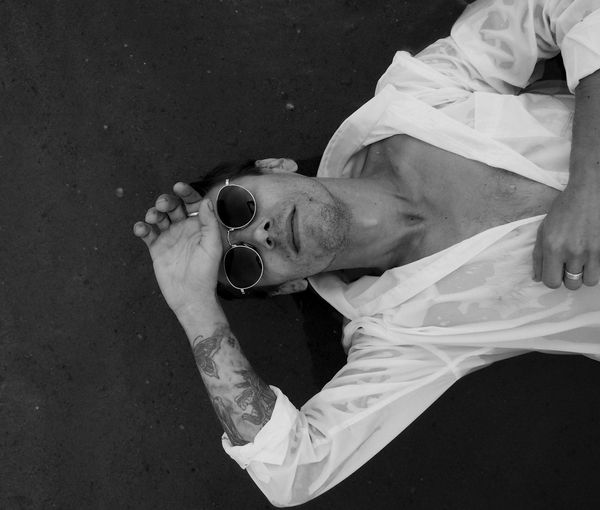 A large image of a person mid-movement in a minimalist setting.